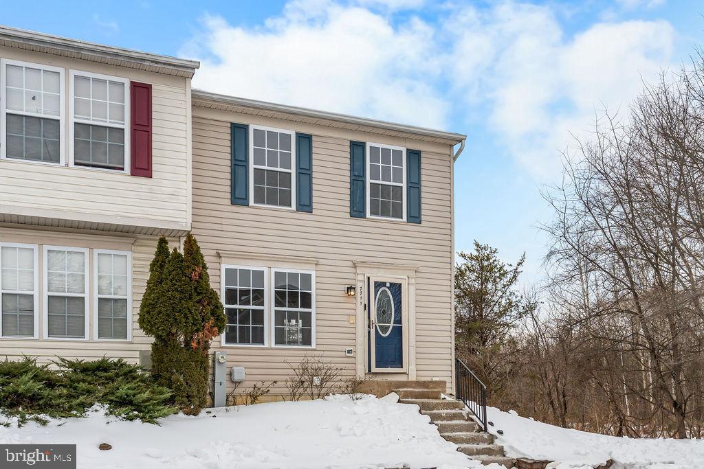 7711 Cornerstone Way Baltimore, MD 21244 - Photo 2 of 33 a front view of a house with a yard