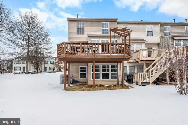a view of a house with a snow in the yard