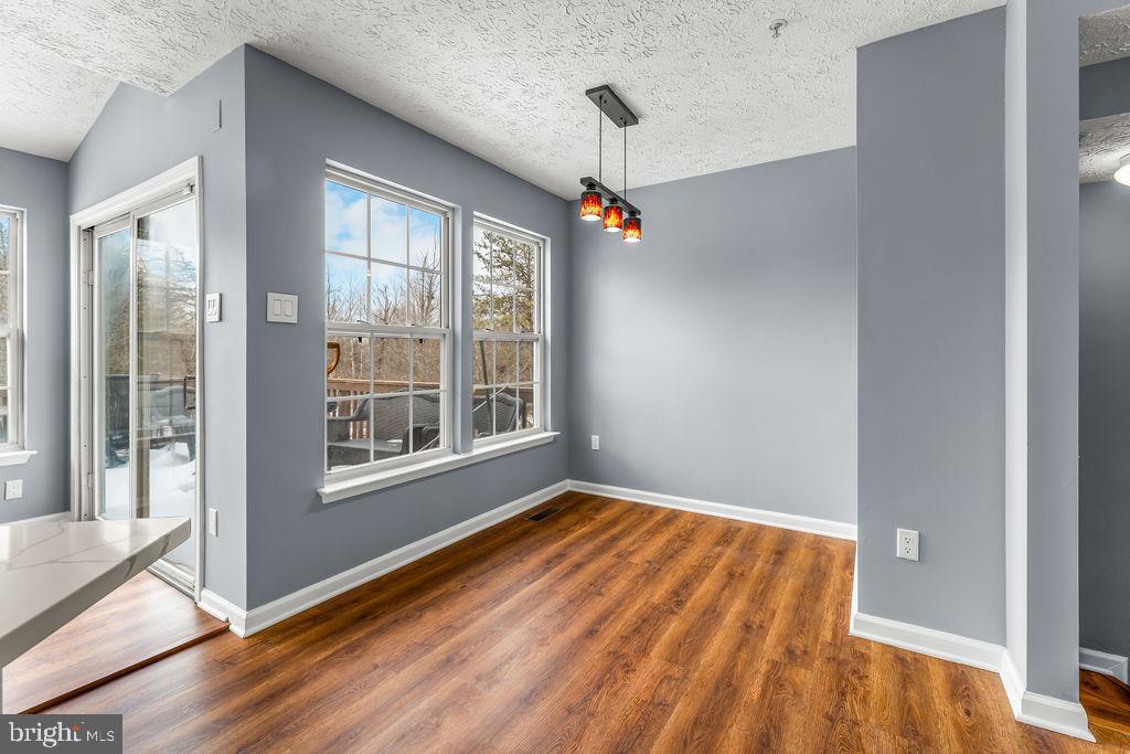 7711 Cornerstone Way Baltimore, MD 21244 - Photo 7 of 33 a view of an empty room with glass door and balcony