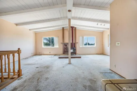 workspace with wooden floor and windows