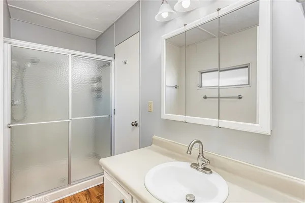 a bathroom with a toilet a sink and a shower