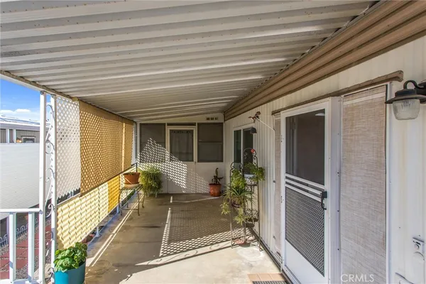 a view of balcony with furniture