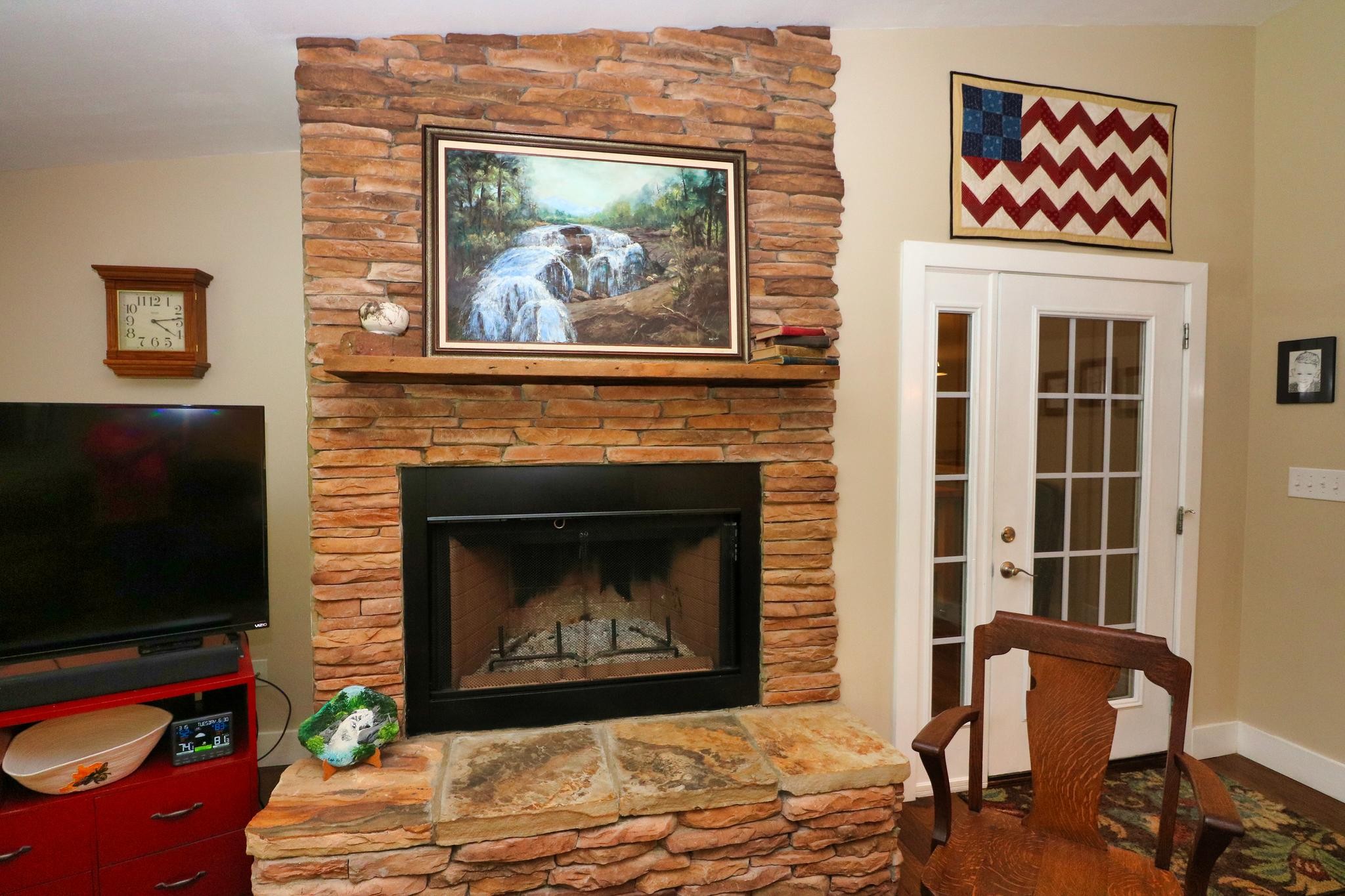 2090 Fairview Road Tellico Plains, TN 37385 - Photo 16 of 40 a living room with furniture a flat screen tv and a fireplace