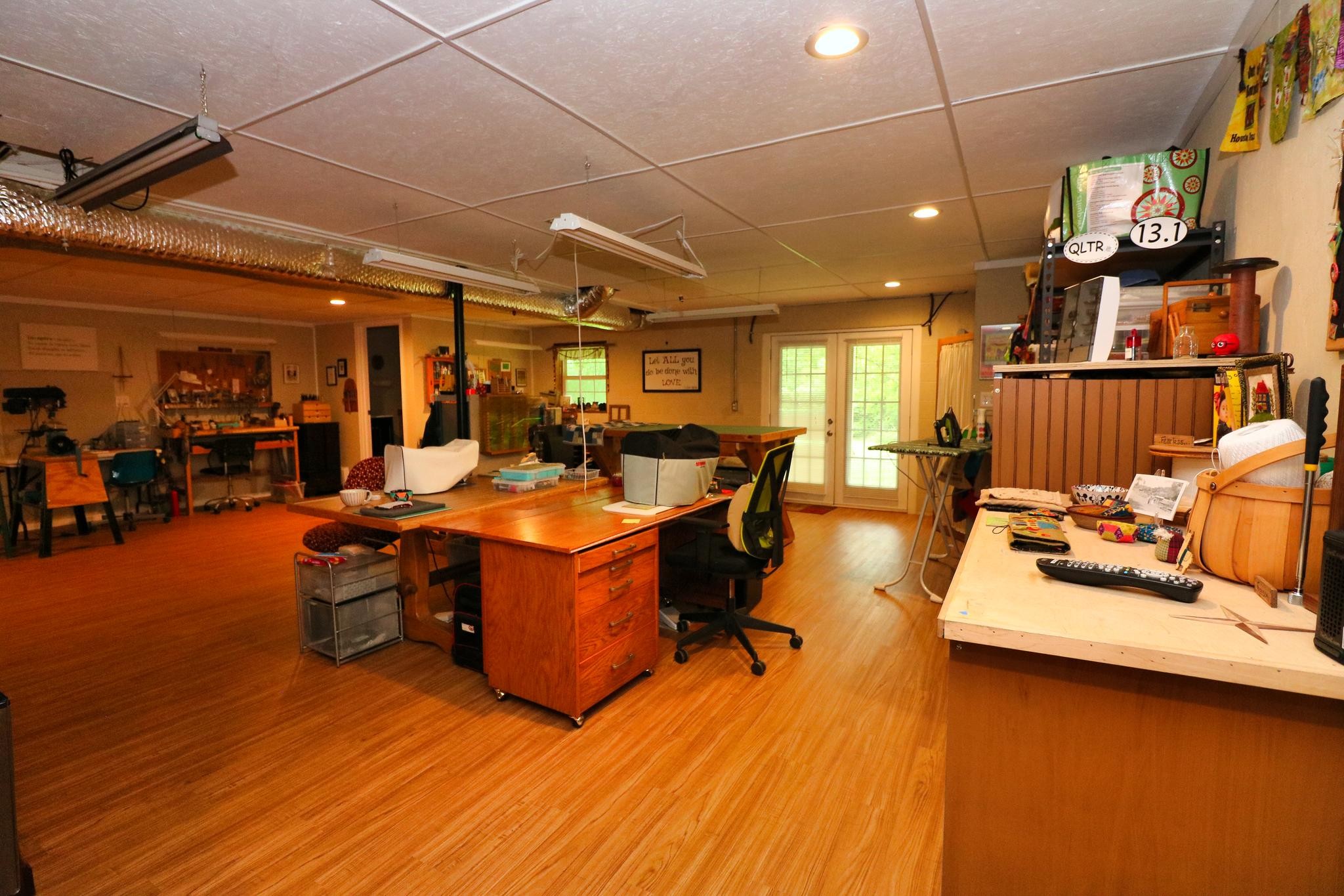 2090 Fairview Road Tellico Plains, TN 37385 - Photo 25 of 40 a living room with furniture and a flat screen tv