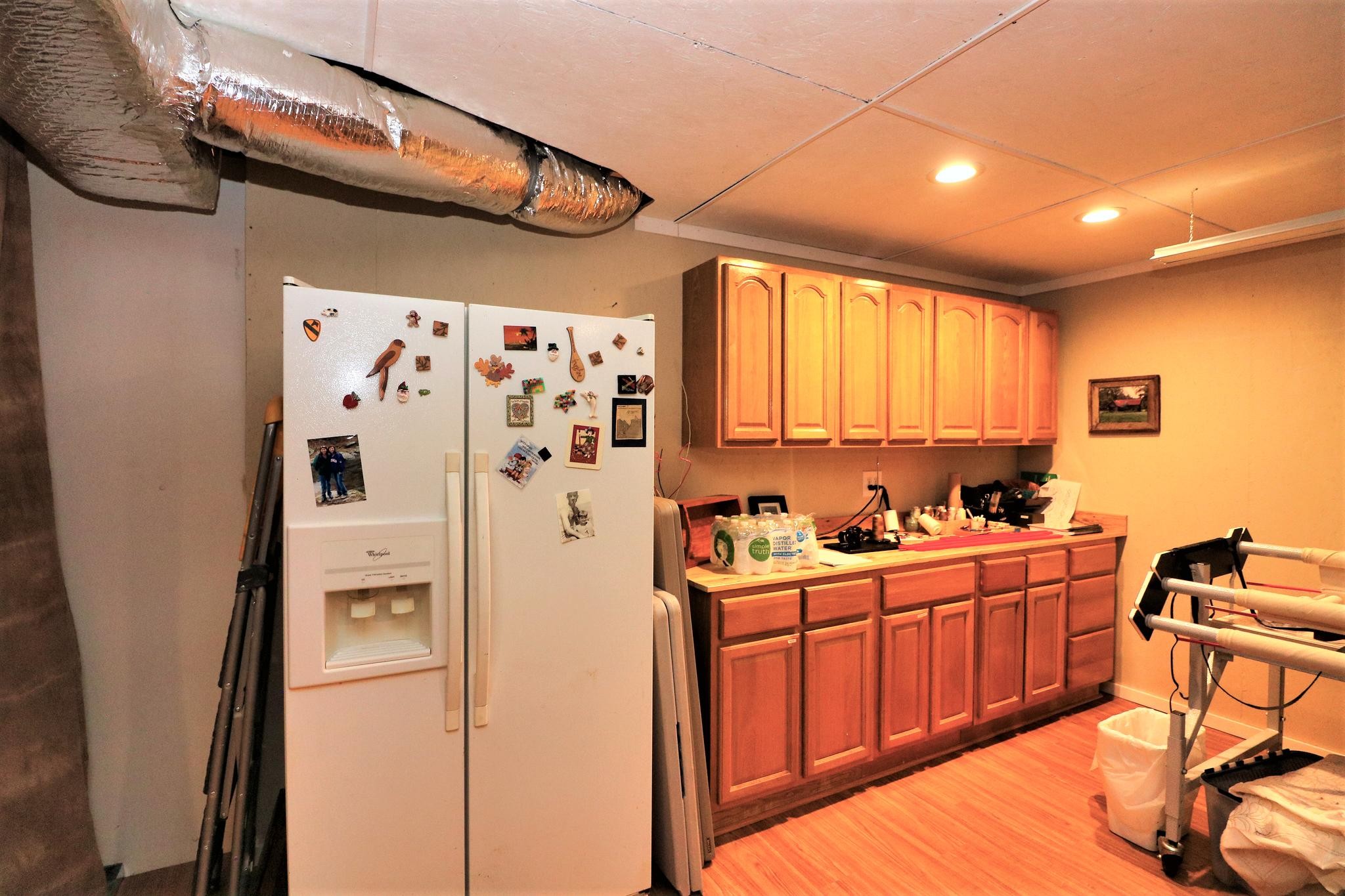 2090 Fairview Road Tellico Plains, TN 37385 - Photo 26 of 40 a kitchen with stainless steel appliances a refrigerator and a stove top oven