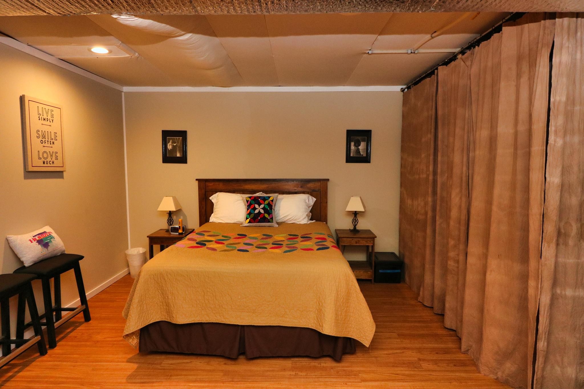 2090 Fairview Road Tellico Plains, TN 37385 - Photo 27 of 40 a bedroom with a bed and wooden floor