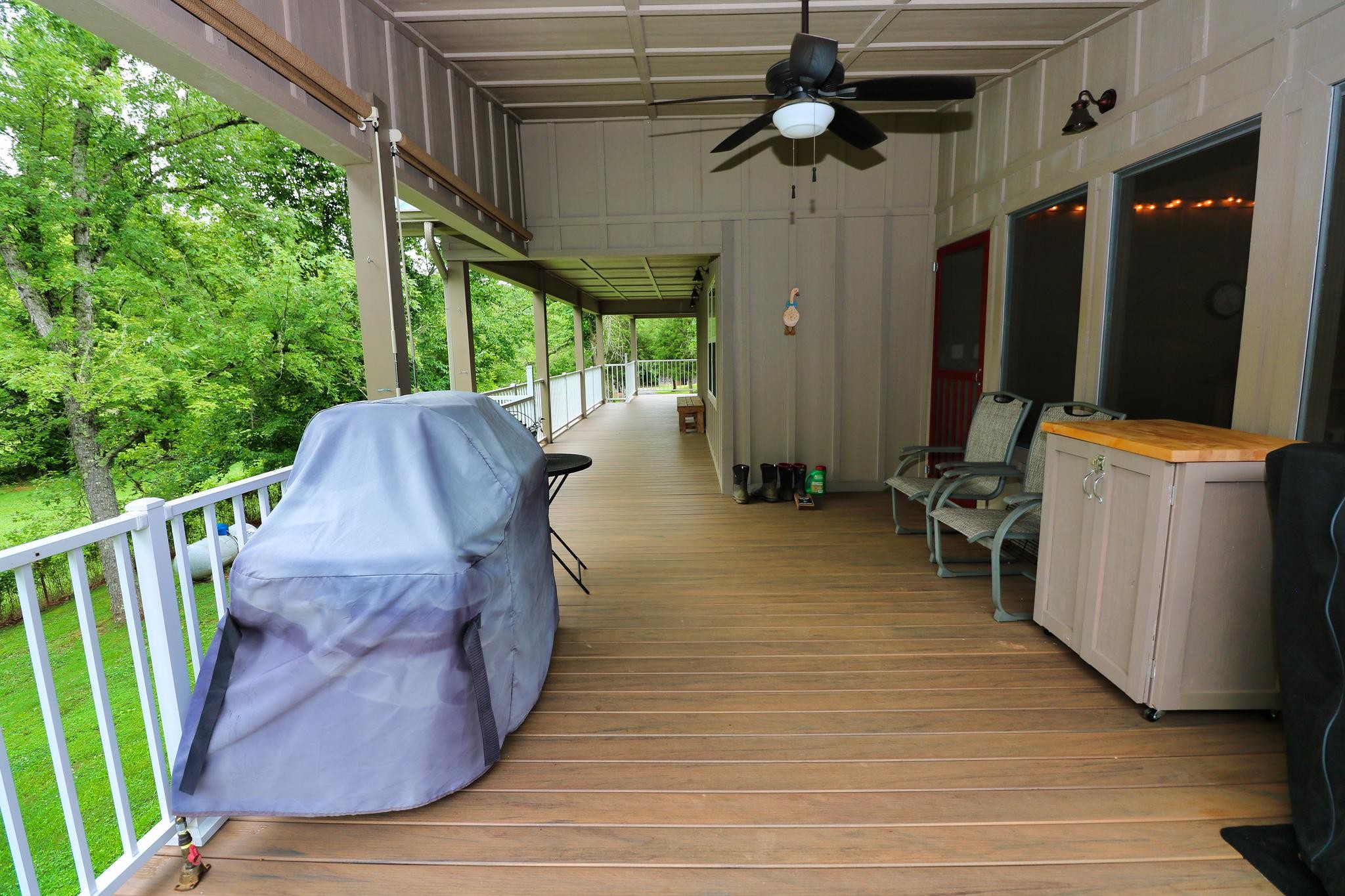 2090 Fairview Road Tellico Plains, TN 37385 - Photo 29 of 40 a view of a porch with wooden floor and outdoor seating