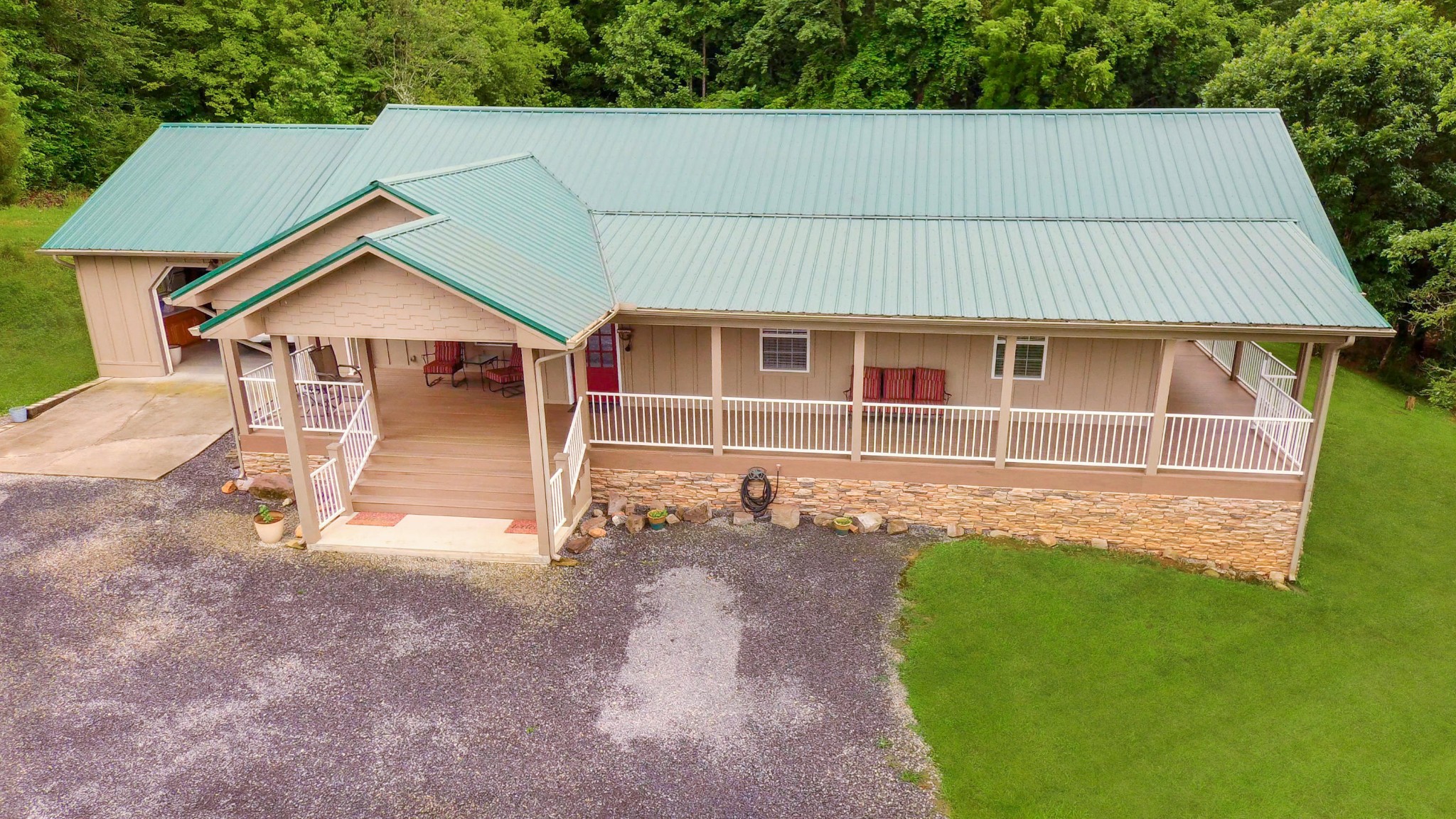 2090 Fairview Road Tellico Plains, TN 37385 - Photo 33 of 40 a backyard of a house with table and chairs