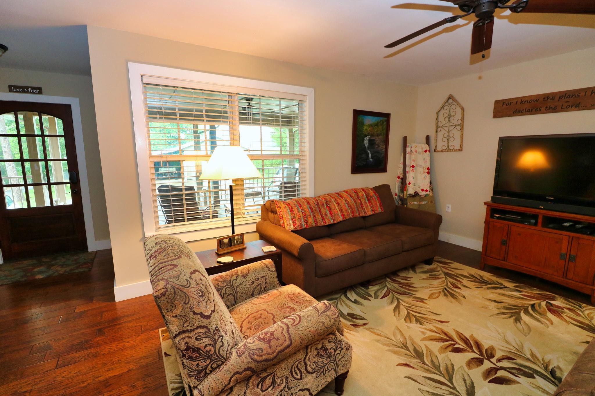 2090 Fairview Road Tellico Plains, TN 37385 - Photo 5 of 40 a living room with furniture and a flat screen tv