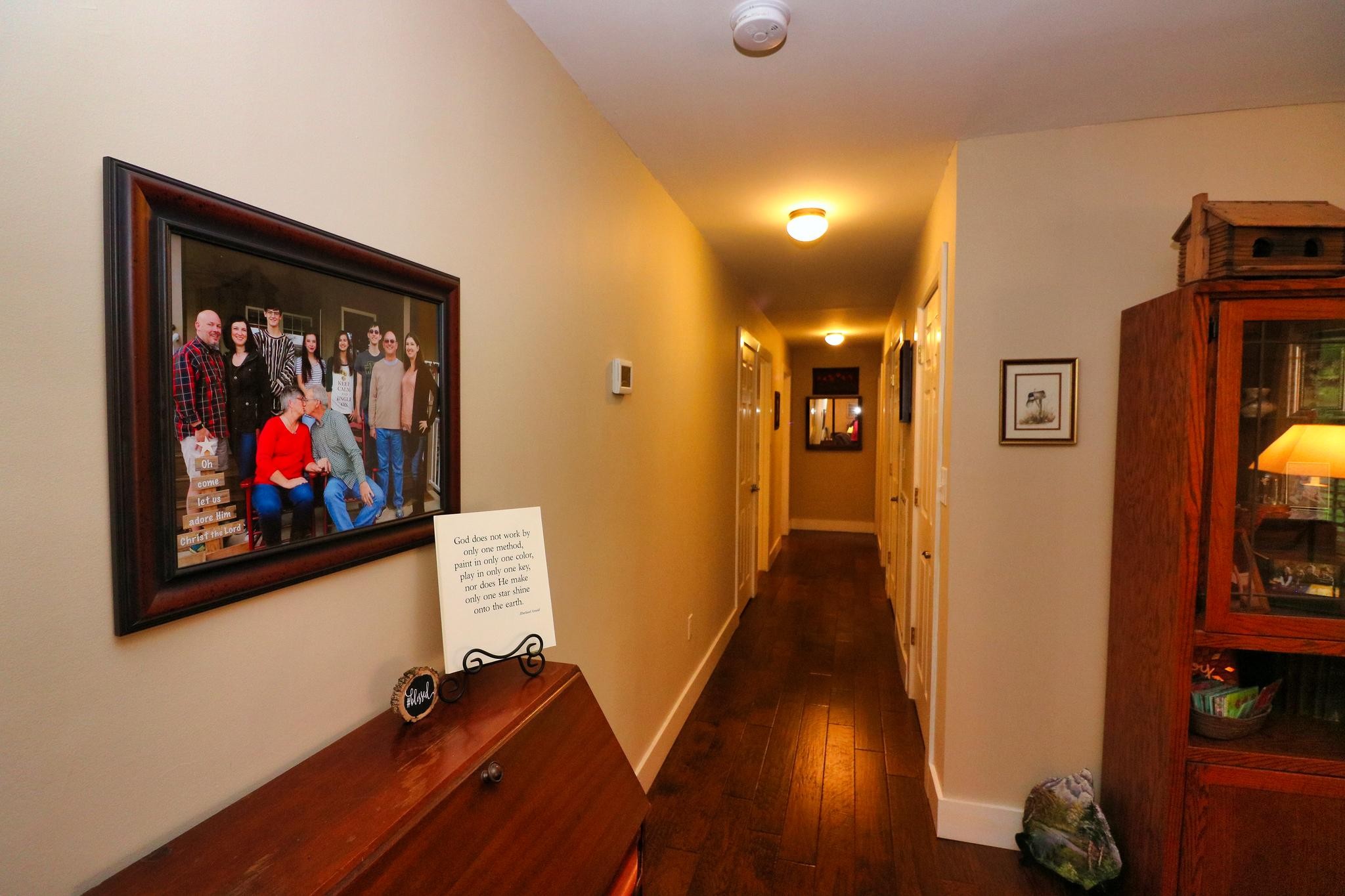 2090 Fairview Road Tellico Plains, TN 37385 - Photo 8 of 40 a view of a hallway with wooden floor and a workspace