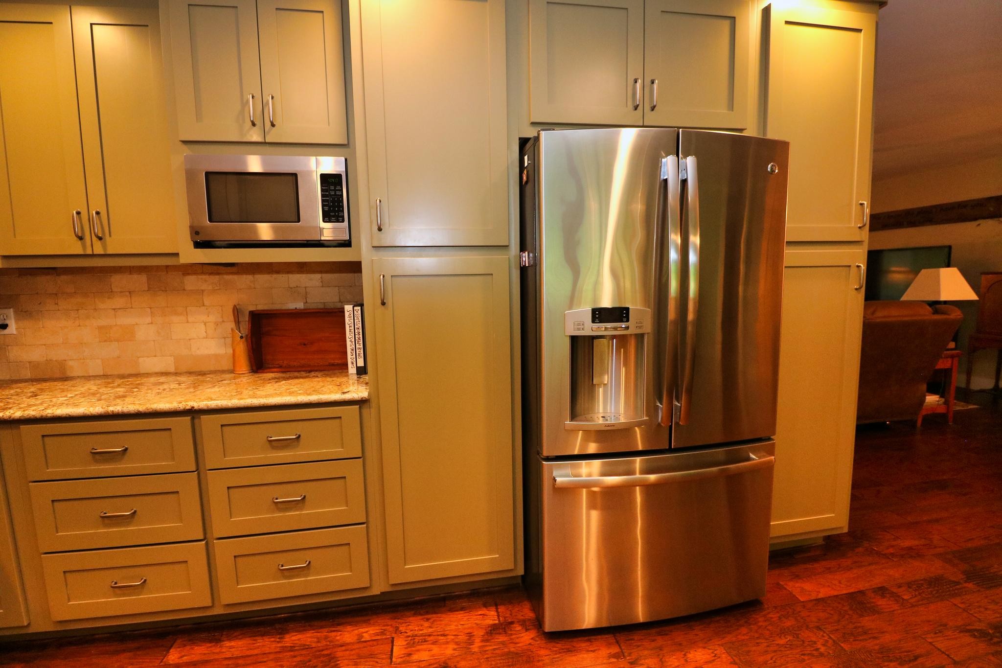2090 Fairview Road Tellico Plains, TN 37385 - Photo 10 of 40 a kitchen with granite countertop stainless steel appliances and refrigerator