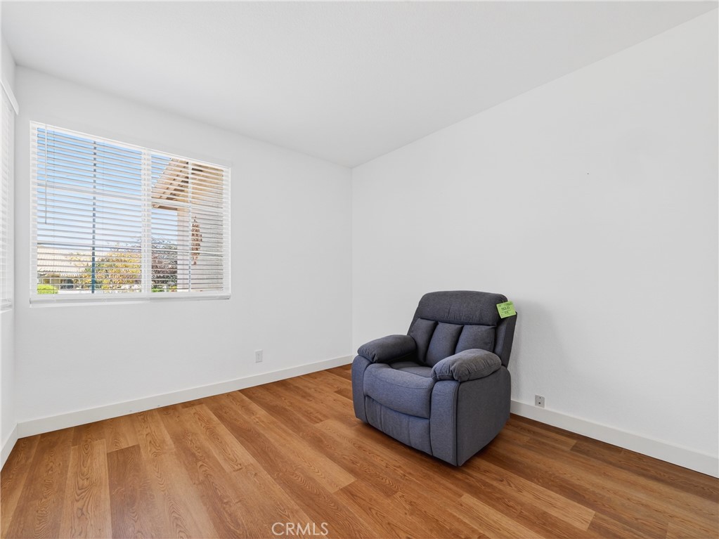 1436 Riviera Avenue Banning, CA 92220 - Photo 22 of 43 a living room with furniture and a window