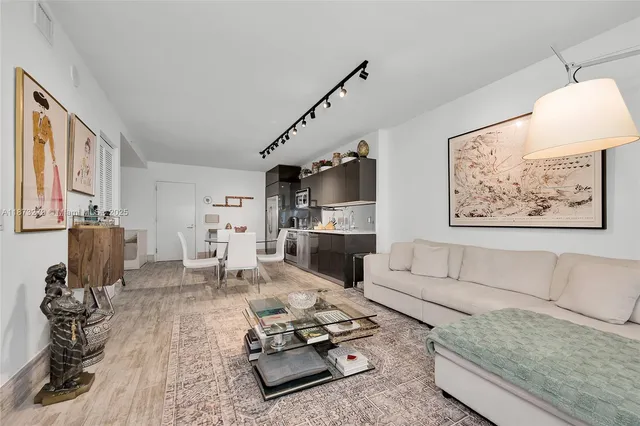 a living room with furniture or couch and a flat screen tv