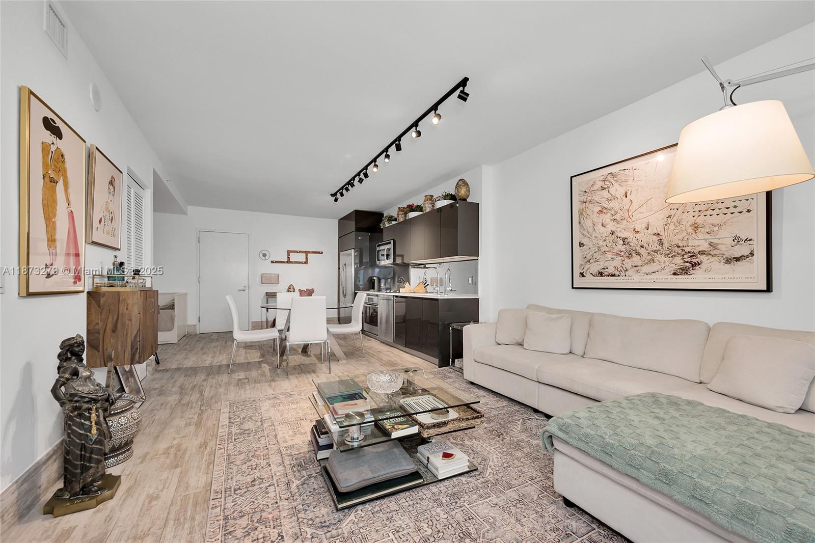 a living room with furniture or couch and a flat screen tv