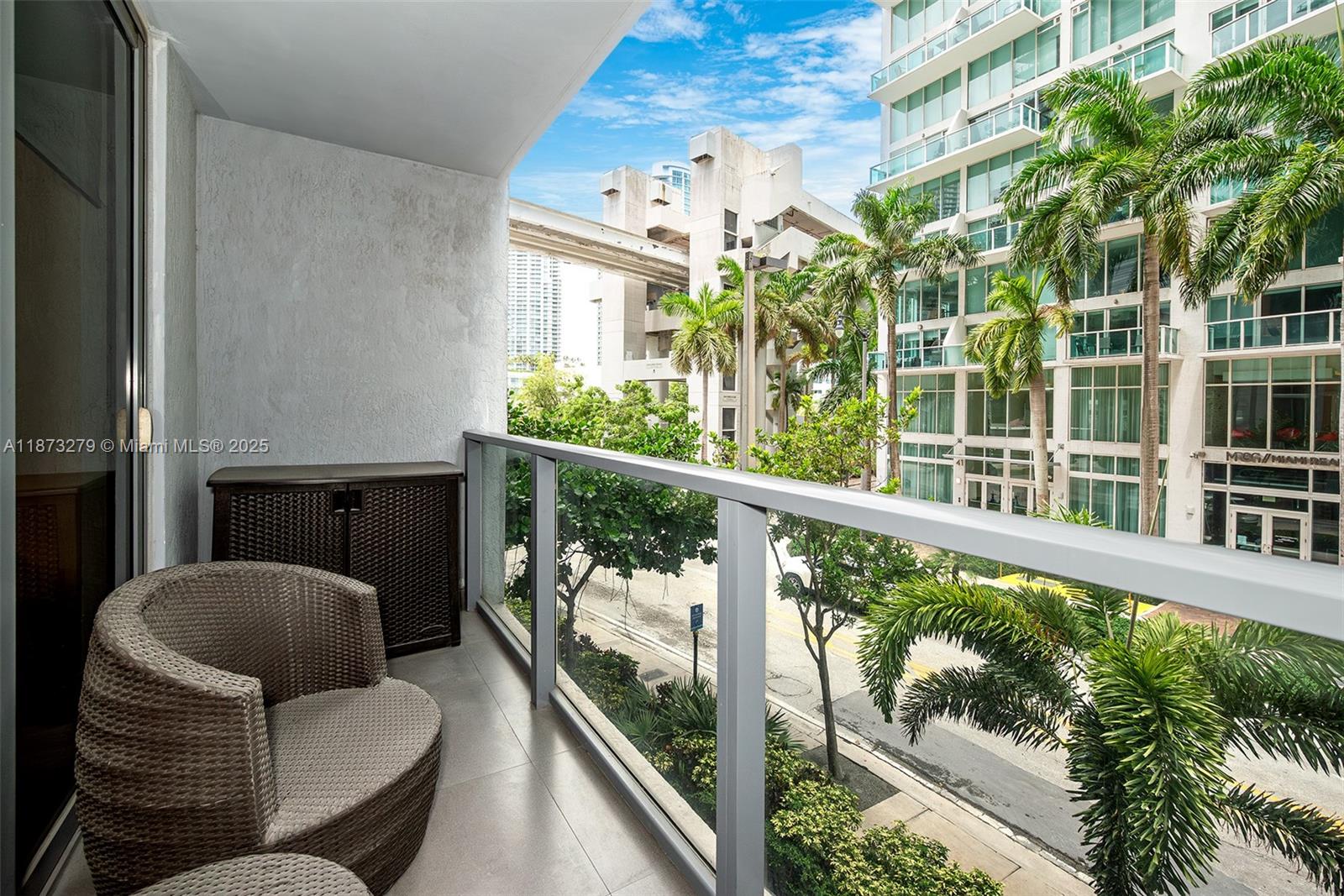 31 Southeast 6th Street, Unit 304 Miami, FL 33131 - Photo 11 of 23 a balcony with furniture and a potted plant