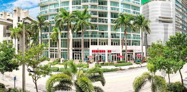 a small garden in the front of a building