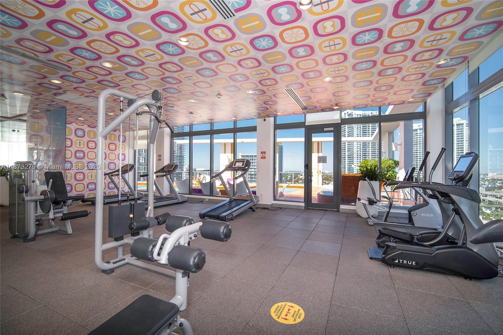 31 Southeast 6th Street, Unit 304 Miami, FL 33131 - Photo 17 of 23 a view of a room with gym equipment