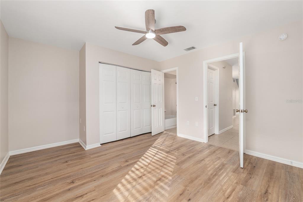 9755 Southwest 52nd Road Gainesville, FL 32608 - Photo 35 of 43 a view of empty room with wooden floor
