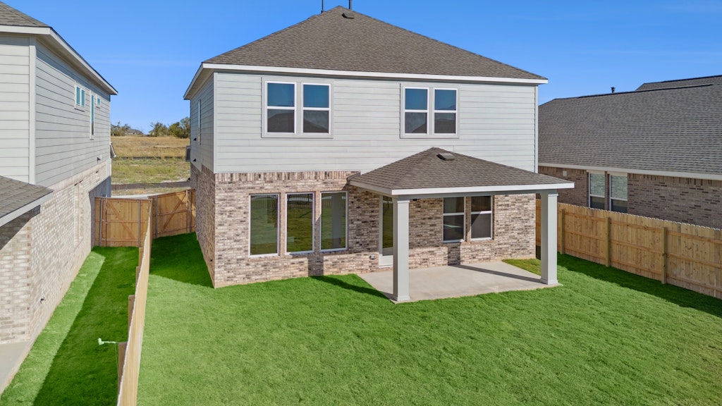 4737 Pleasant Place Round Rock, TX 78665 - Photo 25 of 30 a front view of a house with a yard table and chairs