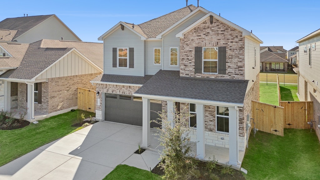 4737 Pleasant Place Round Rock, TX 78665 - Photo 3 of 30 a front view of a house with a garden