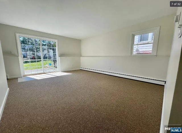 an empty room with a empty space and a window