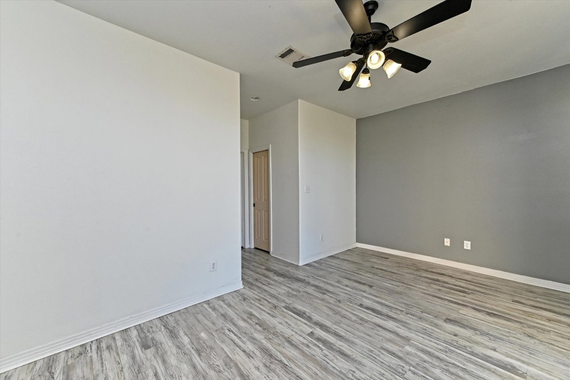 4307 Eck Lane, Unit 107 Austin, TX 78734 - Photo 17 of 28 wooden floor in an empty room