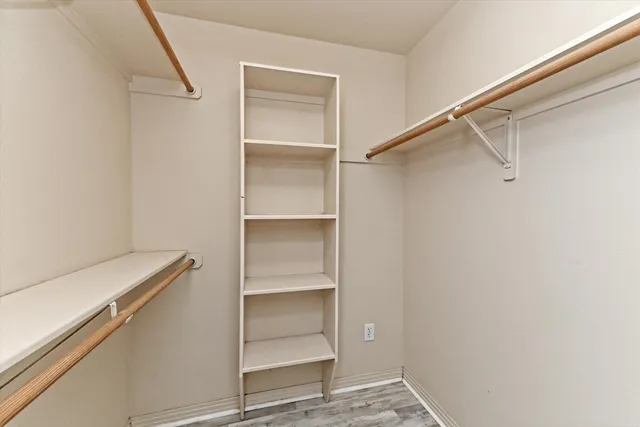 a view of an empty walk in closet