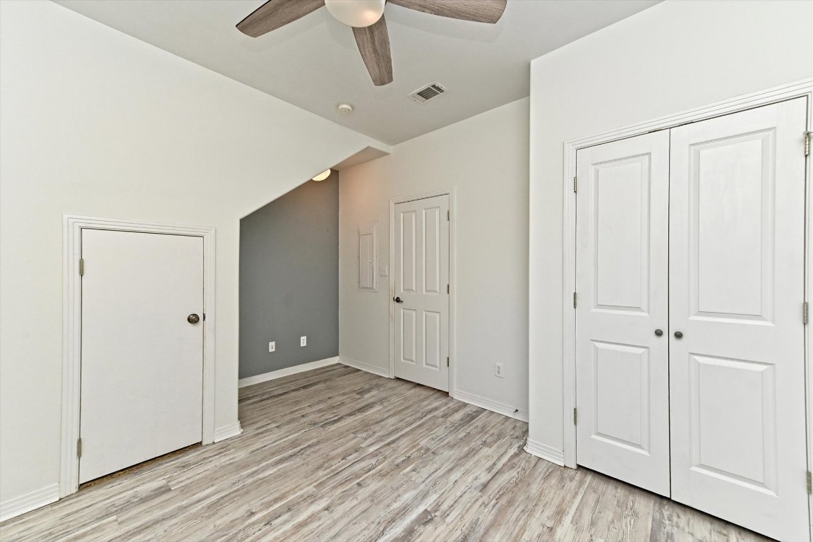 4307 Eck Lane, Unit 107 Austin, TX 78734 - Photo 22 of 28 a view of an empty room with wooden floor