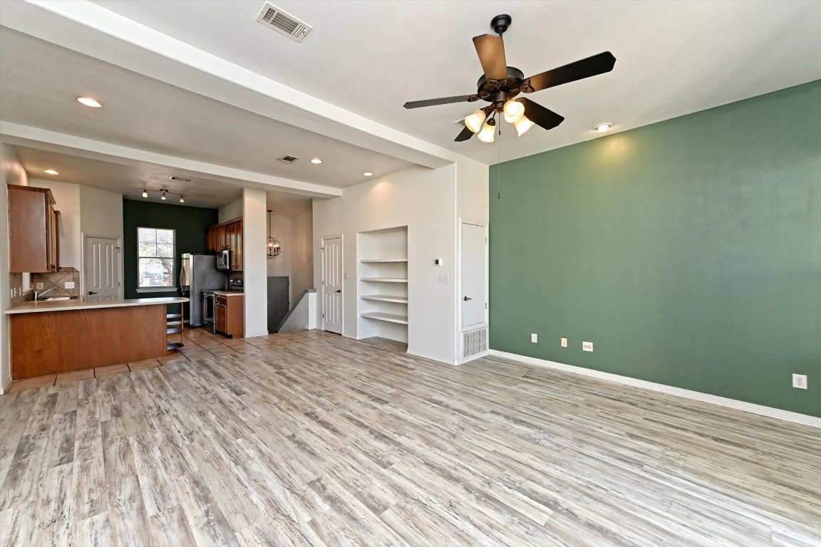 4307 Eck Lane, Unit 107 Austin, TX 78734 - Photo 7 of 28 a view of an empty room and kitchen view