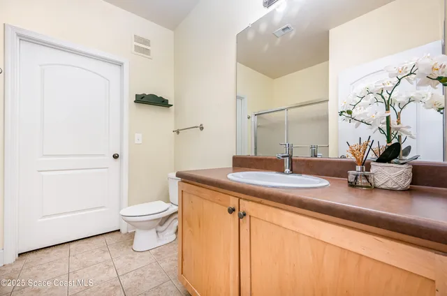 a view of a lake with houses in the back