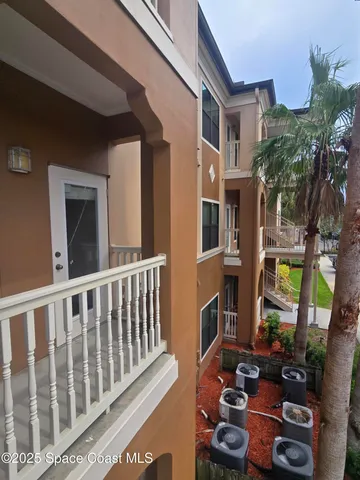 a view of a kitchen with wooden floor