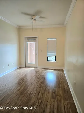 a white refrigerator freezer and a stove sitting inside of a kitchen with stainless steel appliances