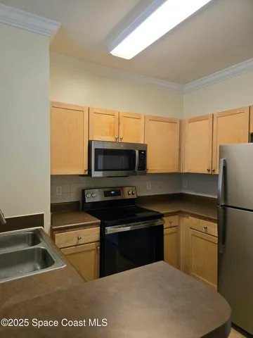 a view of a lake with houses in the back