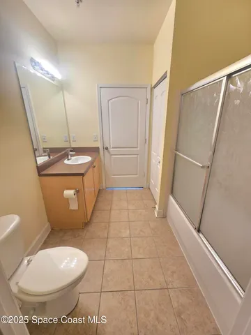 a front view of a residential houses with yard and green space