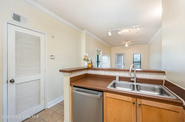 a bathroom with a granite countertop sink a toilet and mirror