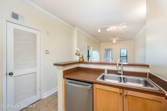 a bathroom with a granite countertop sink a toilet and mirror