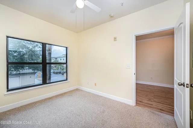 a view of balcony with wooden floor