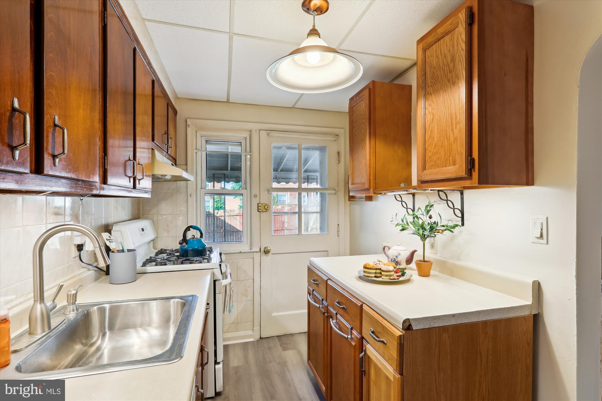 1075 Elm Road Halethorpe, MD 21227 - Photo 13 of 41 a kitchen with a sink cabinets and window