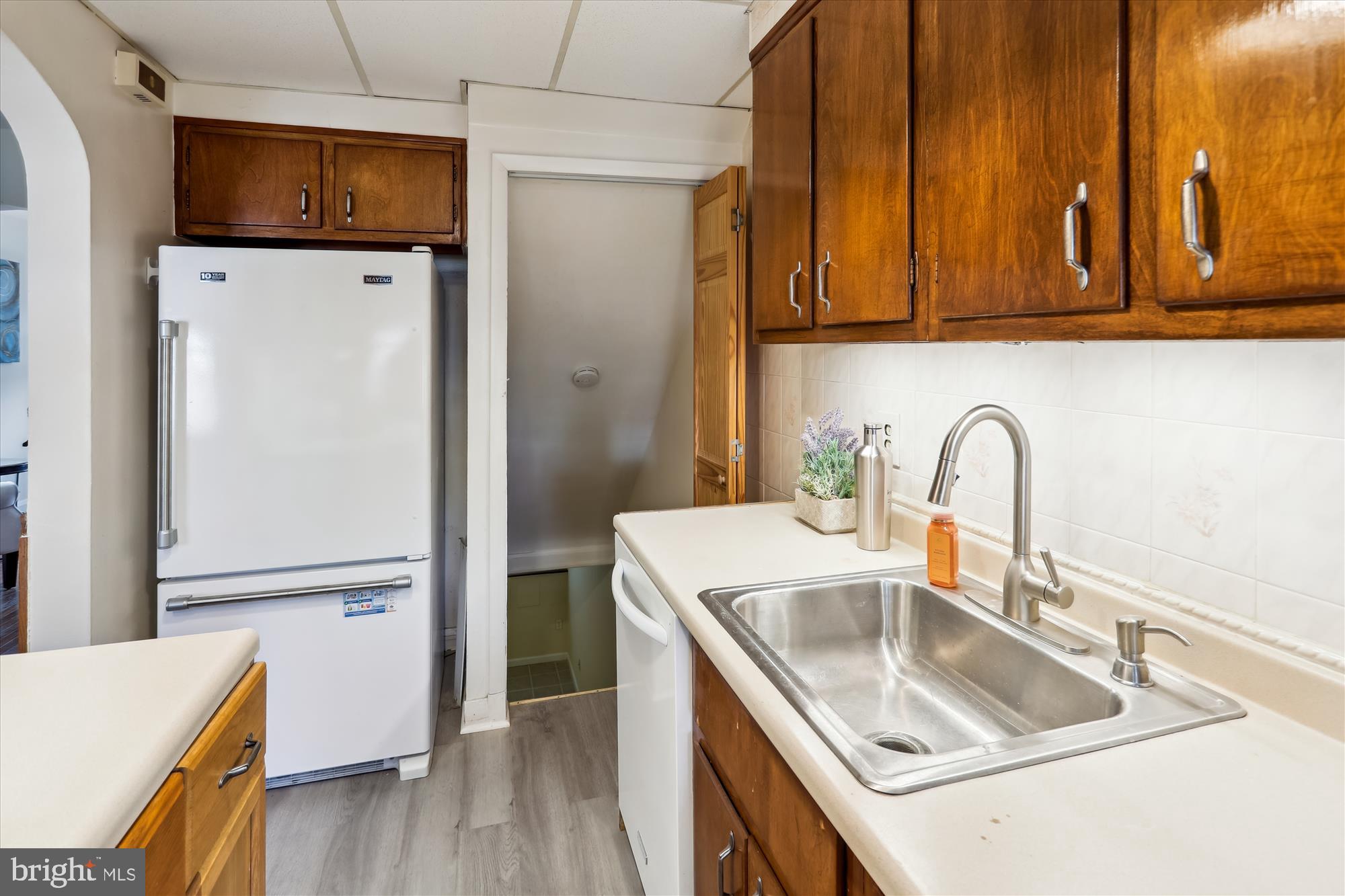 1075 Elm Road Halethorpe, MD 21227 - Photo 15 of 41 a kitchen with granite countertop a refrigerator and a sink