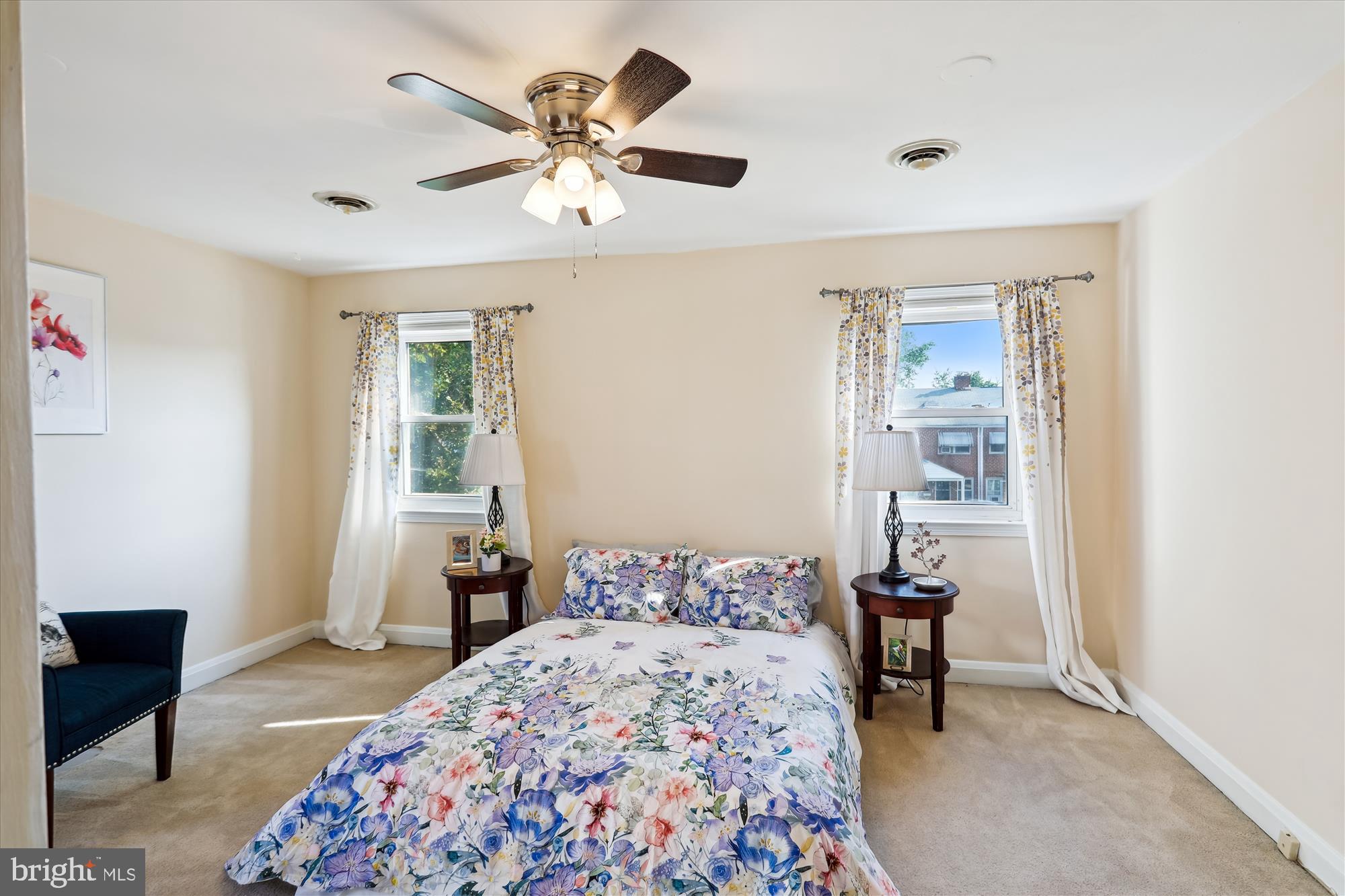1075 Elm Road Halethorpe, MD 21227 - Photo 18 of 41 a bedroom with a bed and a chandelier