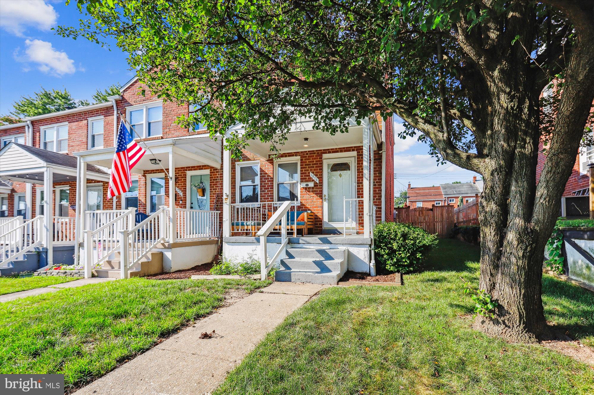 1075 Elm Road Halethorpe, MD 21227 - Photo 2 of 41 a front view of a house with a yard and a tree
