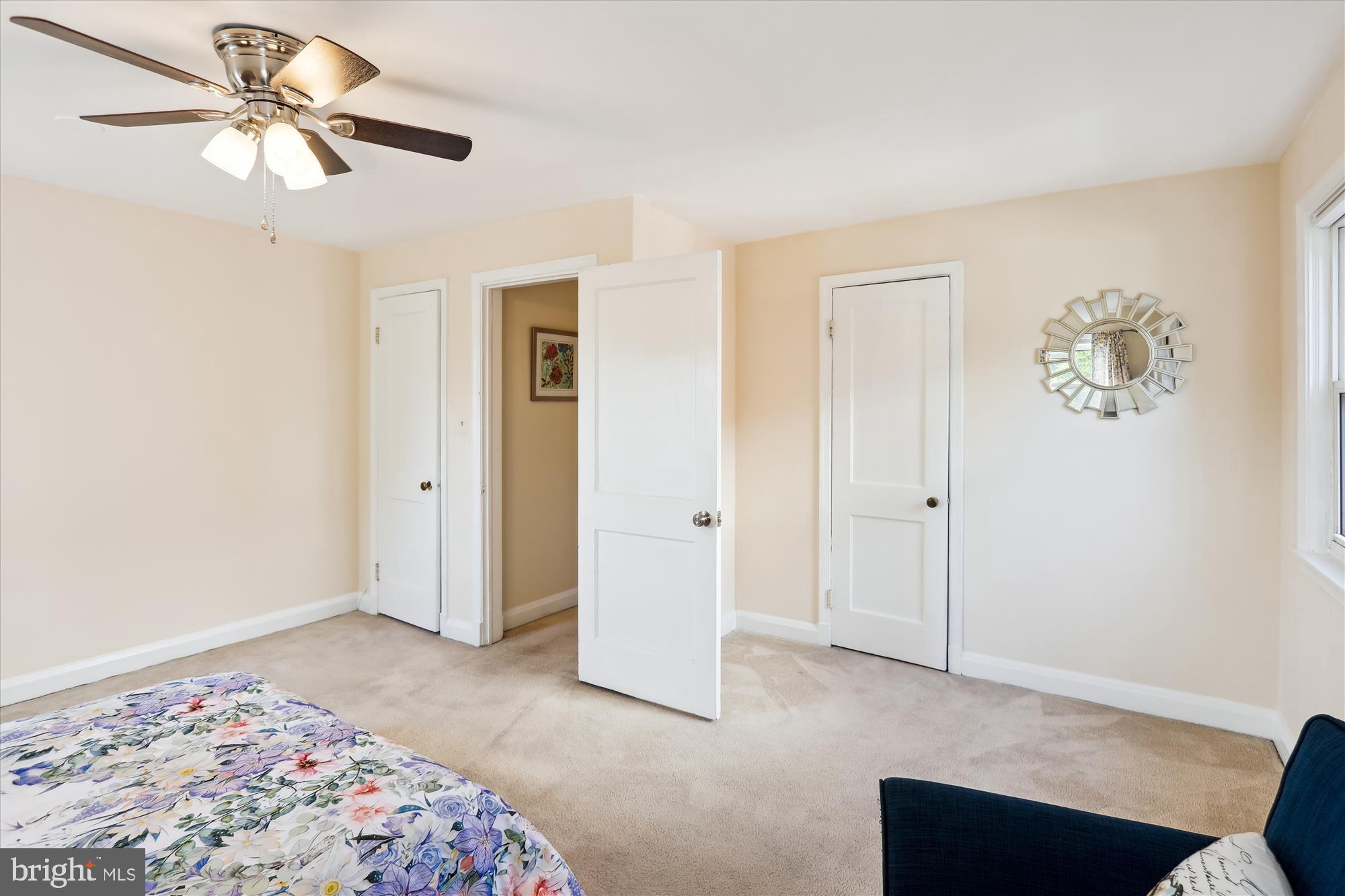 1075 Elm Road Halethorpe, MD 21227 - Photo 21 of 41 a bedroom with a bed and a chandelier