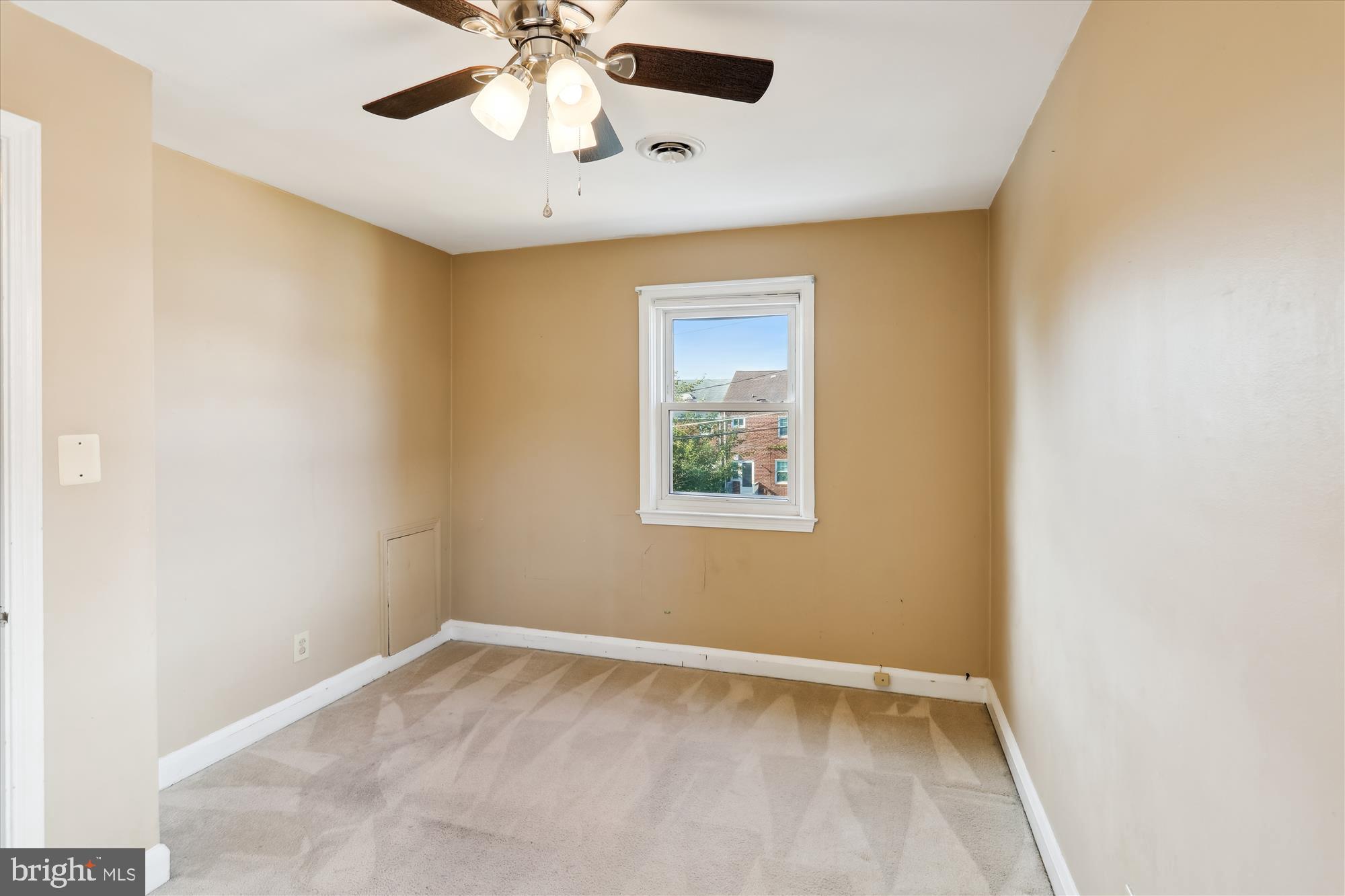 1075 Elm Road Halethorpe, MD 21227 - Photo 23 of 41 an empty room with a window and a fan