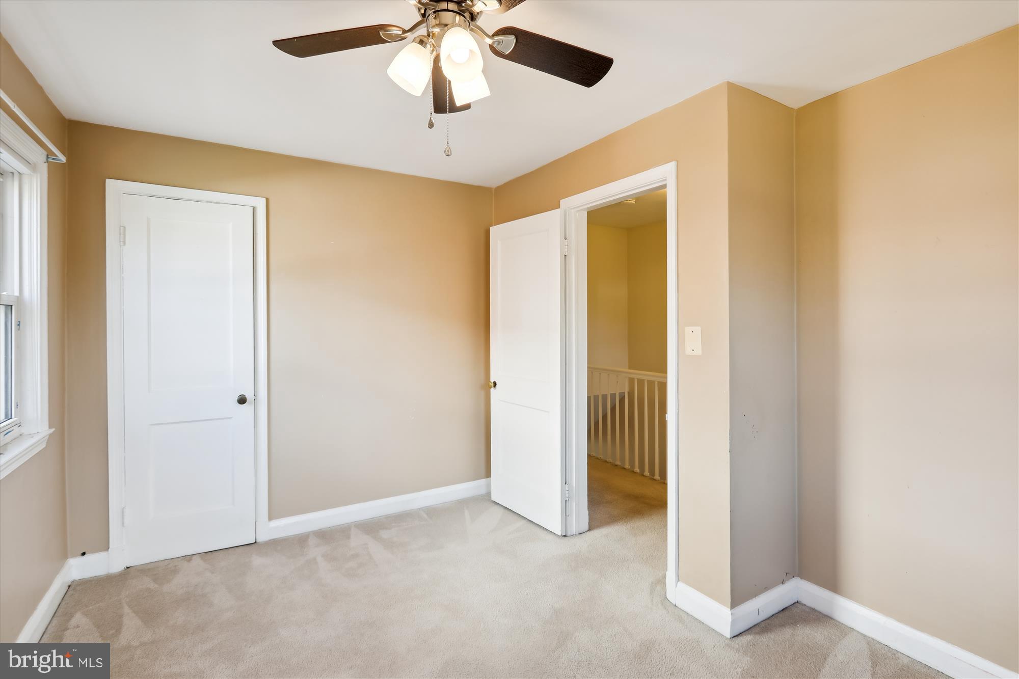 1075 Elm Road Halethorpe, MD 21227 - Photo 24 of 41 an empty room with a ceiling fan and a window