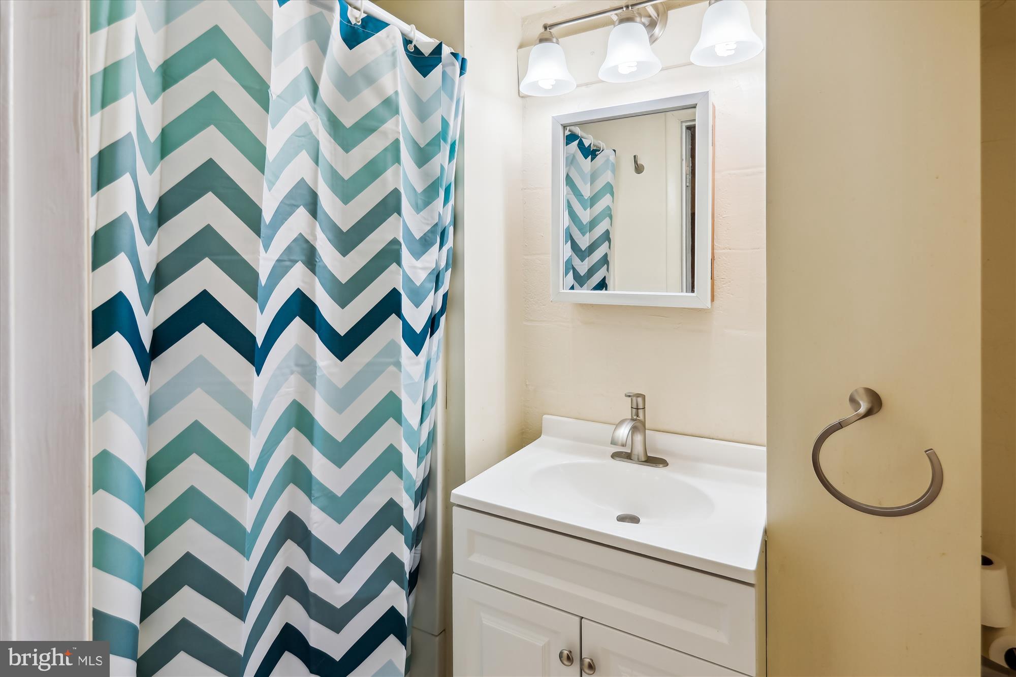 1075 Elm Road Halethorpe, MD 21227 - Photo 29 of 41 a bathroom with a sink toilet and mirror
