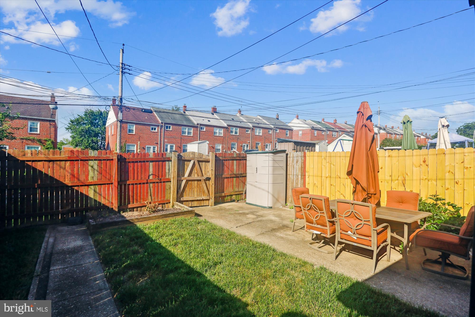 1075 Elm Road Halethorpe, MD 21227 - Photo 5 of 41 a view of a patio with table and chairs potted plants with wooden floor