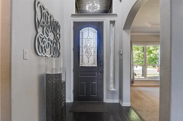 a front view of a door with wooden door