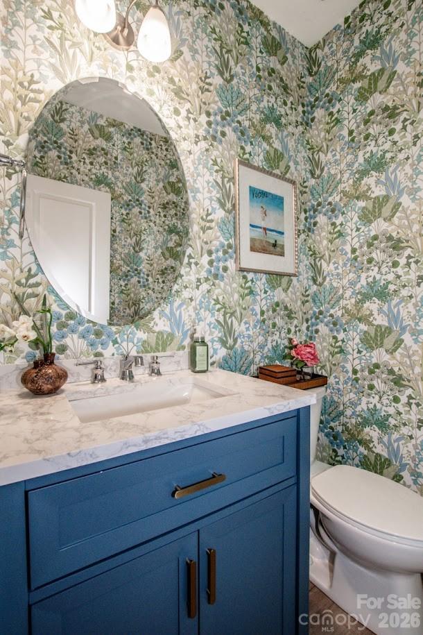 1270 Brawley School Road, Unit F Mooresville, NC 28117 - Photo 19 of 37 a bathroom with a toilet sink and mirror