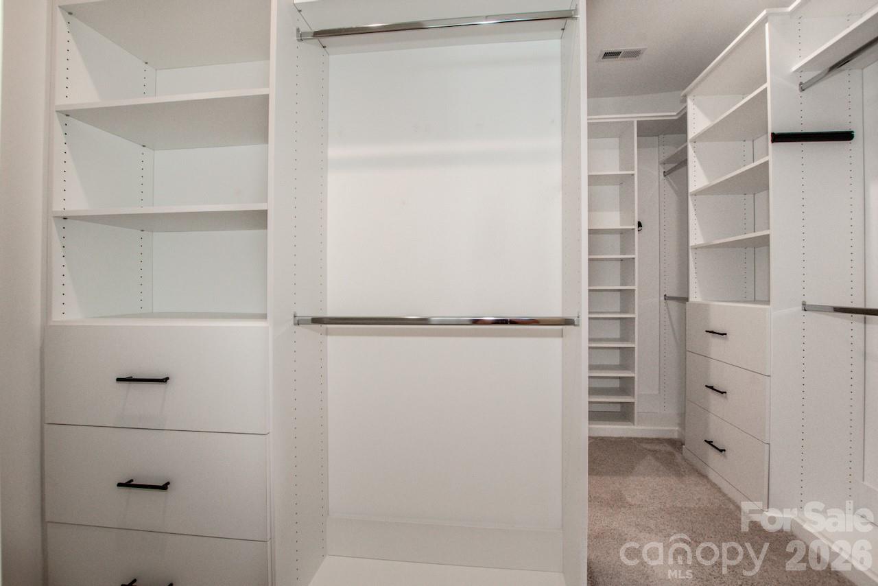 1270 Brawley School Road, Unit F Mooresville, NC 28117 - Photo 24 of 37 a view of walk in closet with empty racks