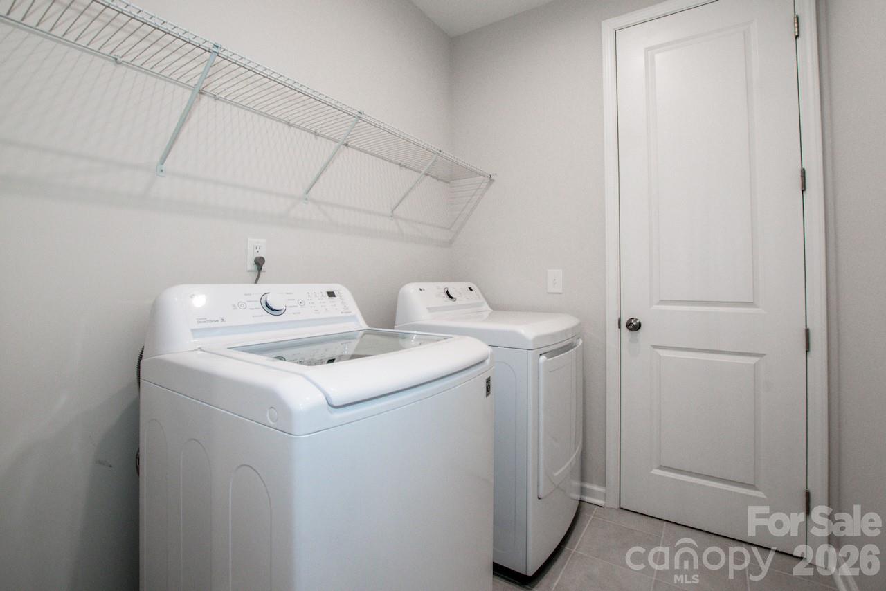 1270 Brawley School Road, Unit F Mooresville, NC 28117 - Photo 28 of 37 a utility room with dryer and washer